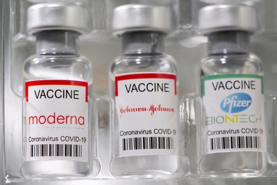 Vials labelled "Moderna, Johnson & Johnson, Pfizer-BioNTech coronavirus disease (COVID-19) vaccine" are seen in this illustration picture taken May 2, 2021 – Reuters/Dado Ruvic/File