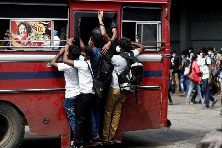 An overcrowded bus leaves the main bus stand before curfew starts, after a clash between anti-government demonstrators and Sri Lanka's ruling party supporters, amid the country's economic crisis, in Colombo, Sri Lanka, May 12, 2022. REUTERS