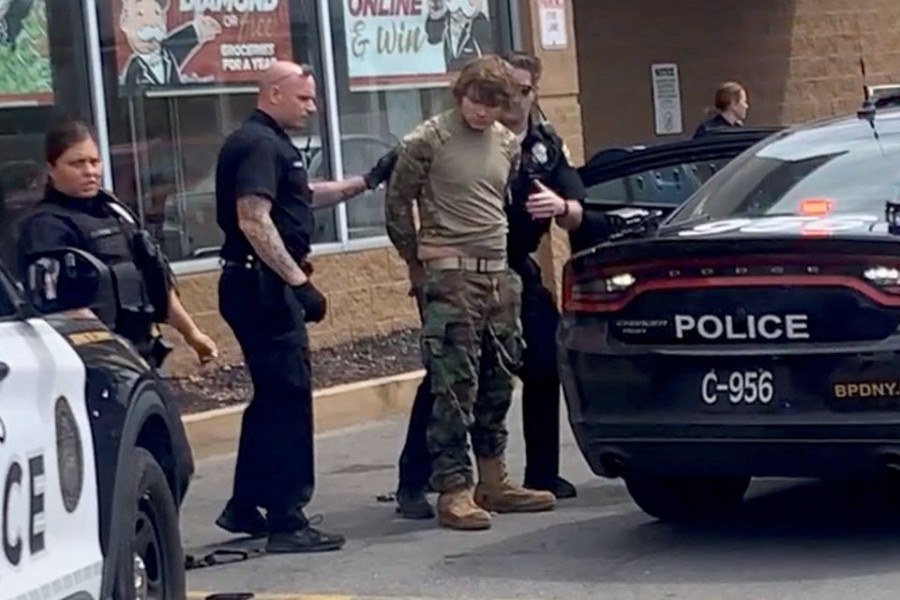 A man is detained following a mass shooting in the parking lot of TOPS supermarket, in a still image from a social media video in Buffalo, New York, U.S. May 14, 2022. Courtesy of BigDawg/ via REUTERS