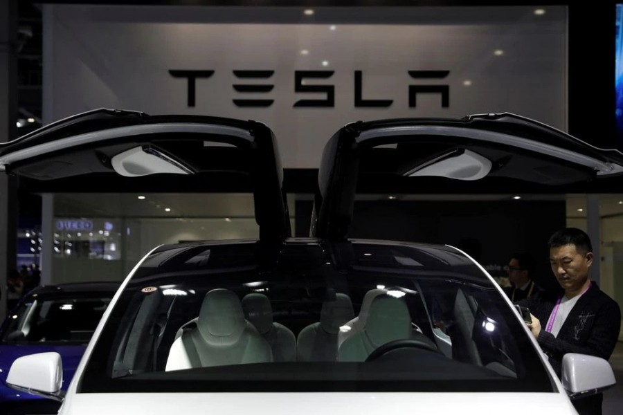 A Tesla sign is seen at the second China International Import Expo (CIIE) in Shanghai, China November 5, 2019. REUTERS/Aly Song/Files