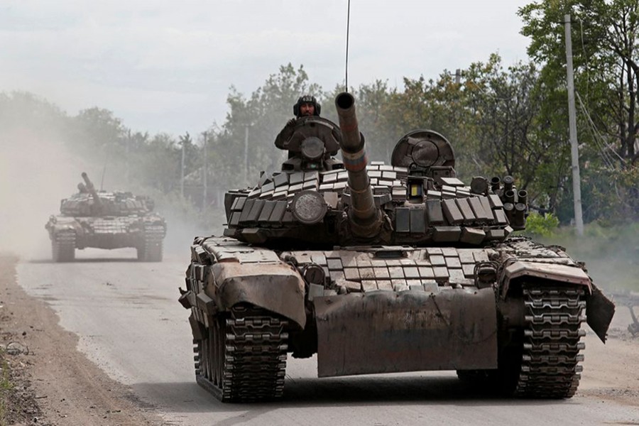 Tanks of pro-Russian troops drive along a street during Ukraine-Russia conflict in the town of Popasna in the Luhansk Region, Ukraine on May 26, 2022 — Reuters photo