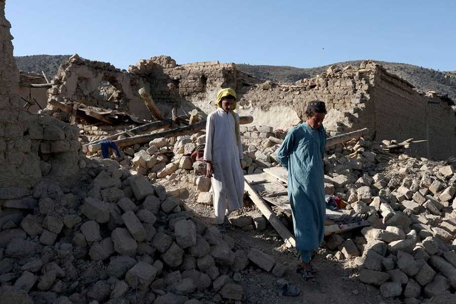 Afghan people walking through the debris of damaged houses on Saturday after the recent earthquake in Wor Kali village in the Barmal district of Paktika province in Afghanistan –Reuters photo