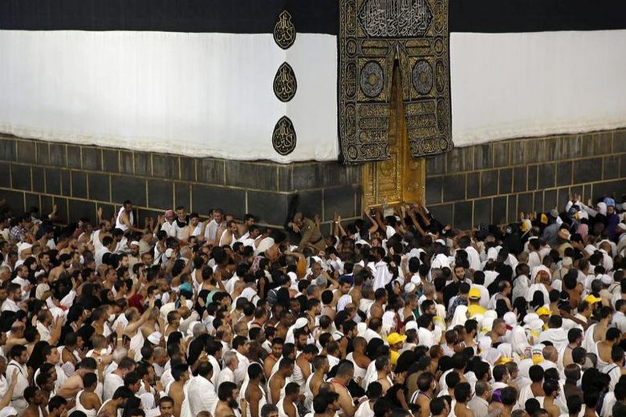 Muslim pilgrims pray around the holy Kaaba at the Grand Mosque ahead of the annual haj pilgrimage in Mecca on September 22, 2015 — Reuters/Files