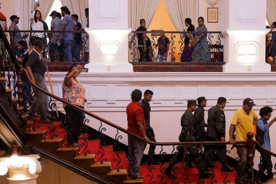 Sri Lankan army members leave after demonstrators entered into the President's House, after President Gotabaya Rajapaksa fled, amid the country's economic crisis, in Colombo, Sri Lanka Jul 9, 2022. Reuters