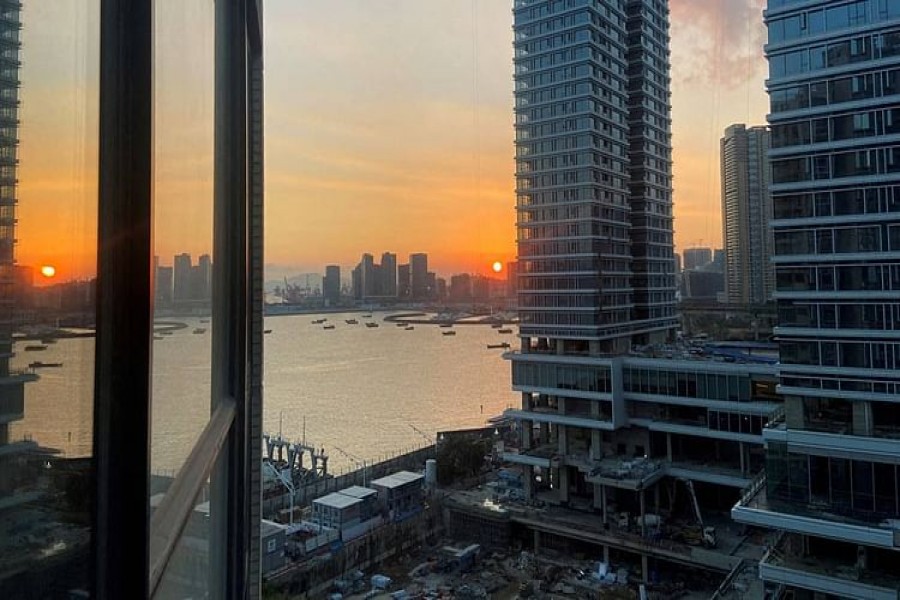 Under-construction apartments are pictured from a building during sunset in the Shekou area of Shenzhen, Guangdong province, China Nov 7, 2021.REUTERS