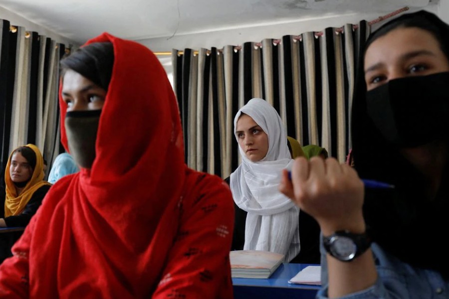 Kerishma Rasheedi, 16, and her classmates attend a lesson at a private school in Kabul, Afghanistan, August 3, 2022. REUTERS/Ali Khara