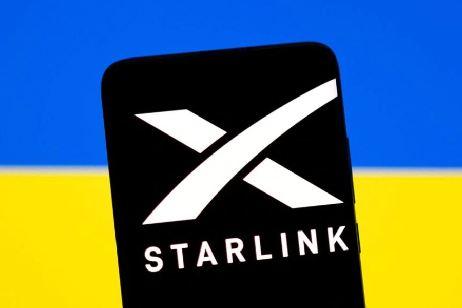 Starlink logo is seen on a smartphone in front of displayed Ukrainian flag in this illustration taken February 27, 2022. REUTERS/Dado Ruvic/Illustration