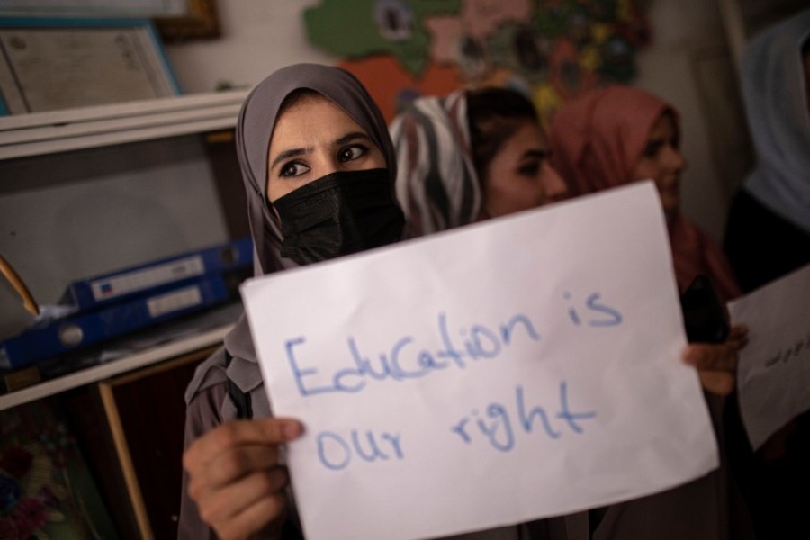 Women, teachers and students demonstrate inside a private school to demand for their rights and equal education for women and girls, during a gathering for National Teachers Day, in Kabul, Afghanistan [File: AP Photo]
