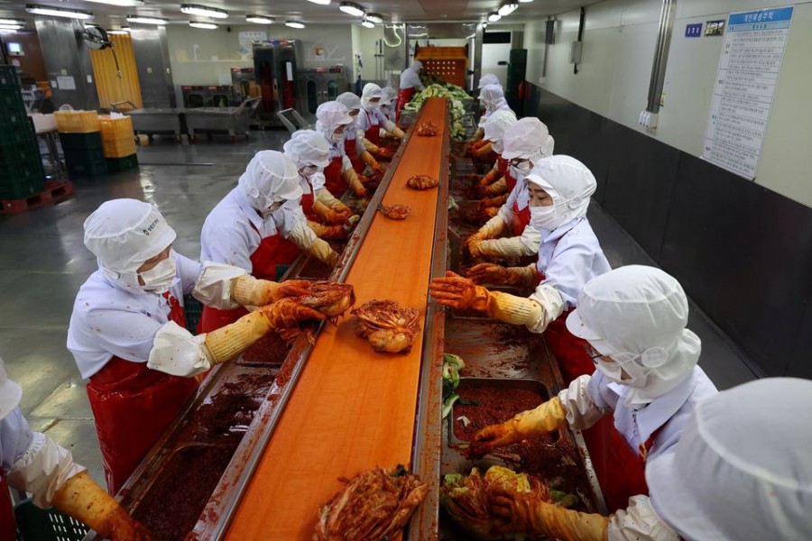 Employees work at Cheongone Organic Kimchi factory in Cheongju, South Korea, September 26, 2022. REUTERS/Kim Hong-Ji