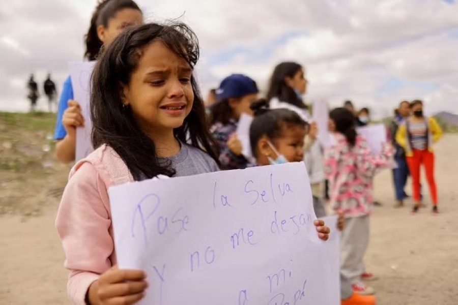 Maria Victoria, 8, cries because she wants to see her father who is in the United States, during a protest on the banks of the Rio Bravo river, after Venezuelan migrants were expelled from the US with their families and sent back to Mexico under Title 42, in Ciudad Juarez, Mexico October 18, 2022. REUTERS