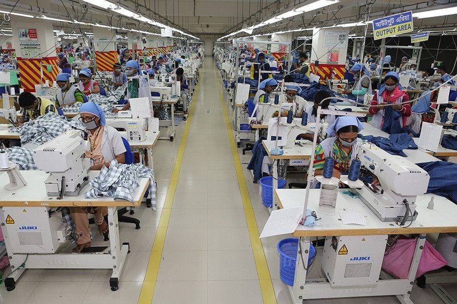 Women work in a garment factory in Dhaka, Bangladesh — FE/Files