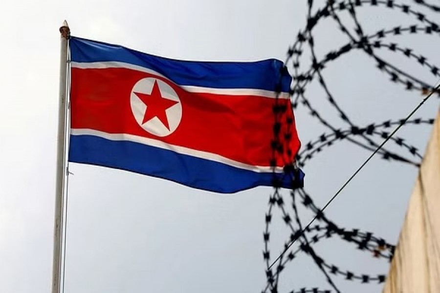 A North Korea flag flutters next to concertina wire at the North Korean embassy in Kuala Lumpur, Malaysia March 9, 2017. REUTERS/Edgar Su