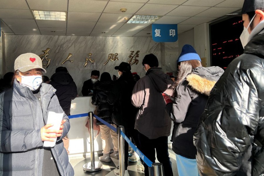 People line up at a government office for entry and exit matters which provides services including making or renewing passports or permits to go to Hong Kong, Macau and Taiwan, after China reopened borders, in Beijing, China on January 9, 2023 — Reuters photo