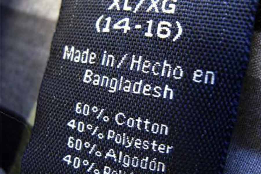 The clothing tag on a boy's shirt which is made in Bangladesh is shown at a market in a Western country -Reuters file photo