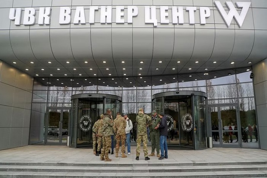 Visitors gather outside PMC Wagner Centre, which is a project implemented by the businessman and founder of the Wagner private military group Yevgeny Prigozhin, during the official opening of the office block in Saint Petersburg, Russia, November 4, 2022. REUTERS/Igor Russak