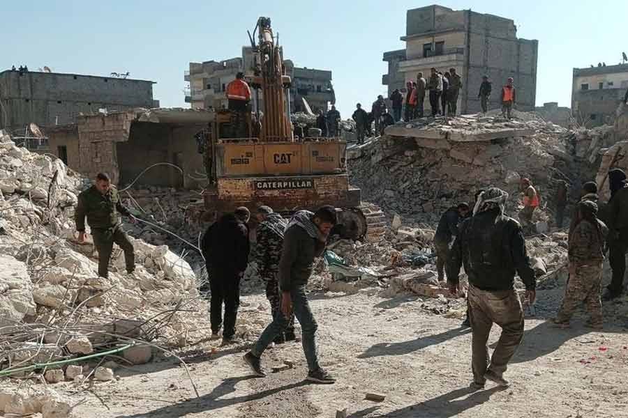 Members of a rescue team working on the scene of a residential building collapse in the Sheikh Maksoud neighbourhood of Aleppo in Syria on Sunday –Reuters file photo