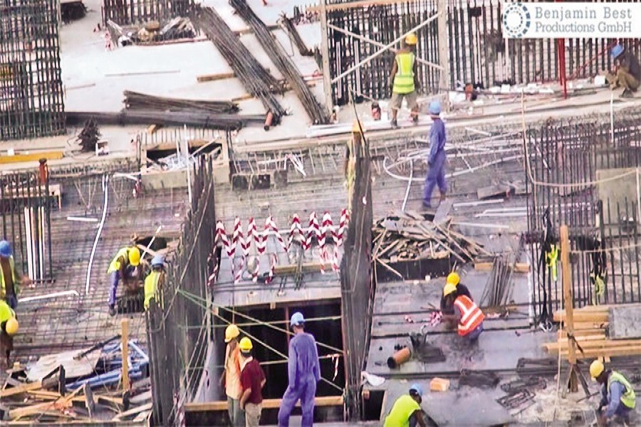 In this screen grab from a German broadcaster WDR documentary video posted on YouTube in 2019, foreign labourers are seen at work at a stadium being built in Qatar in preparation for the 2022 World Cup — Arab News Photo