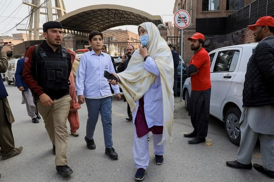 A woman reacts as she searches for her relatives, after a suicide blast in a mosque in Peshawar, Pakistan, Jan 30, 2023. REUTERS
