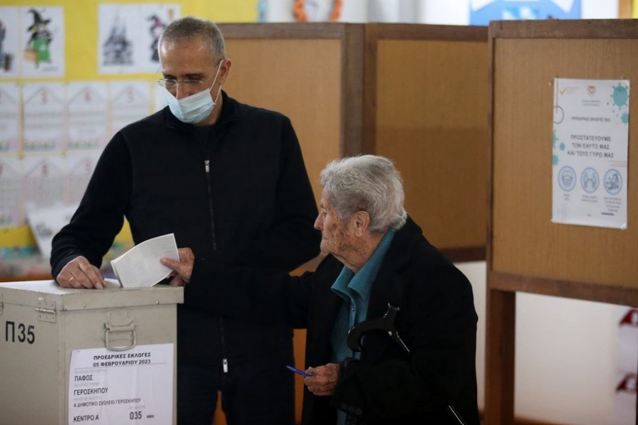A person casts a ballot for the presidential election at a polling station in Geroskipou near Paphos, Cyprus, February 5, 2023. REUTERS/Yiannis Kourtoglou