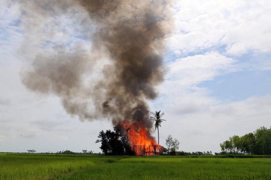 A house is seen on fire in Gawduthar village, Maungdaw township, in the north of Rakhine state, Myanmar. (Reuters File Photo)
