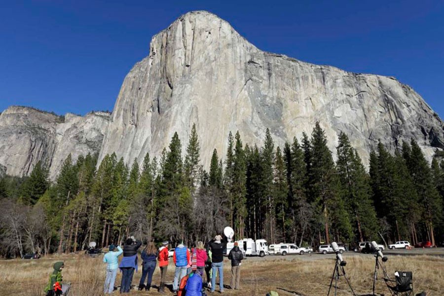 Spectators look at El Capitan, a rock formation above Yosemite Valley. (AP photo)