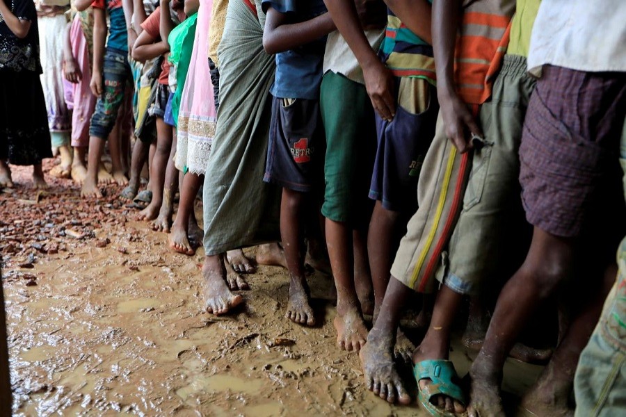 Rohingya refugees line up at registration centre in Kutupalong refugees camp in Cox's Bazar, October 20, 2017. Reuters