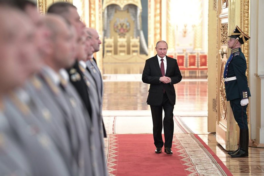 Russian President Vladimir Putin walks in a hall during a meeting at Kremlin in Moscow on Thursday. -AP Photo