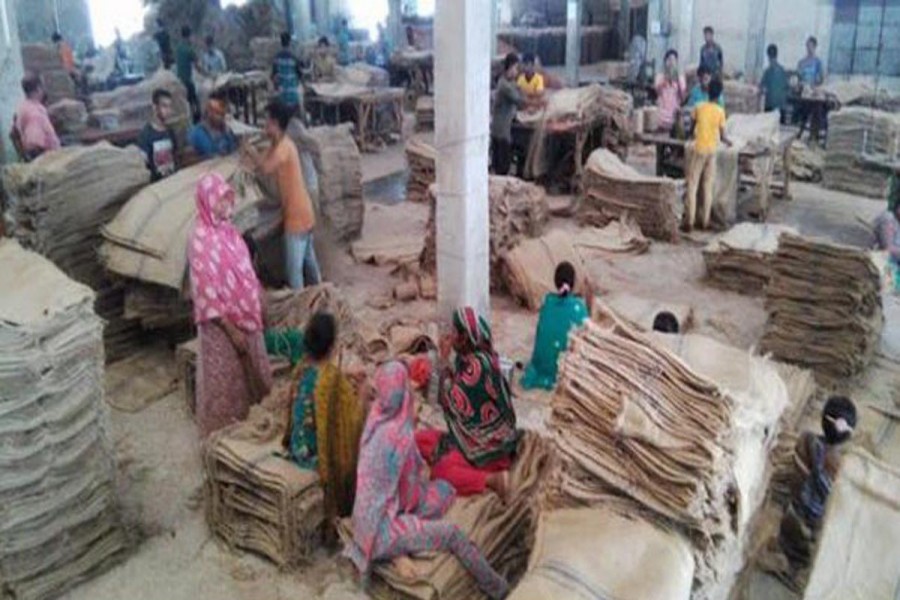 Female labourers work at Shah Sultan Jute Mills in Chalkbochal area under Gabtoly upazila of Bogra. The photo was taken on Tuesday. 	— FE Photo