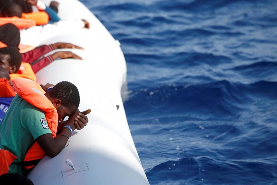 Migrants are seen during rescue operation in the Mediterranea Sea October 20, 2016. Italian Red Cross press office/Handout via Reuters