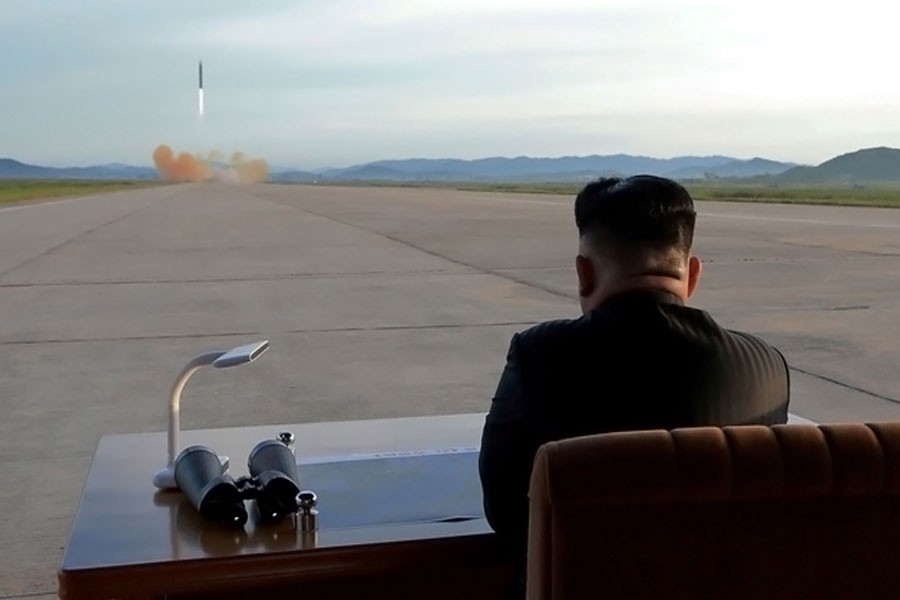 North Korean leader Kim Jong Un watches the launch of a Hwasong-12 missile in this undated photo released by North Korea's Korean Central News Agency (KCNA) on Sept 16, 2017. (Reuters)