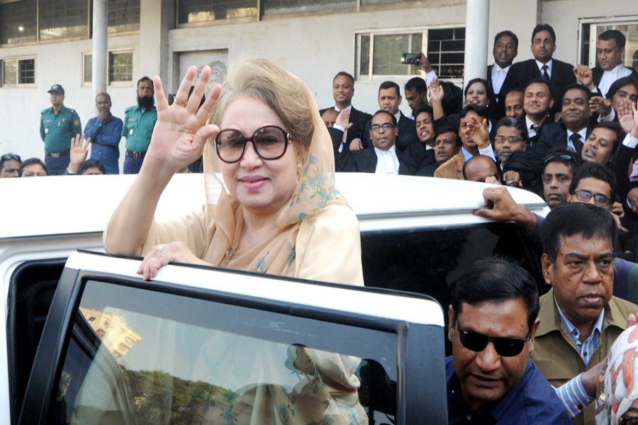 BNP Chairperson Khaleda Zia waves to party supporters after appearing before a special judge's court at Bakshibazar in the city on Tuesday in the Zia Orphanage Trust and Zia Charitable Trust graft cases. 	— Focus Bangla