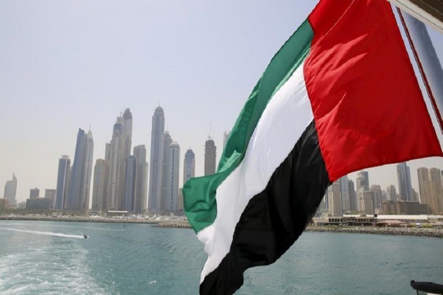 UAE flag flies over a boat at Dubai Marina, Dubai, United Arab Emirates May 22, 2015. Reuters/Files