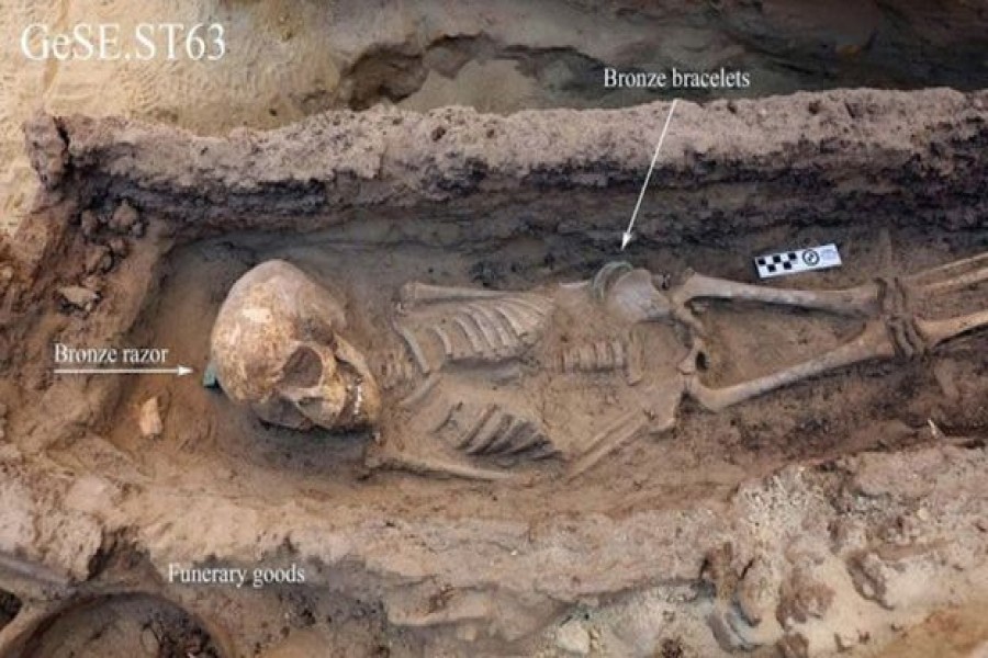 The remains of a child aged between six and nine were found in a wooden sarcophagus. -BBC