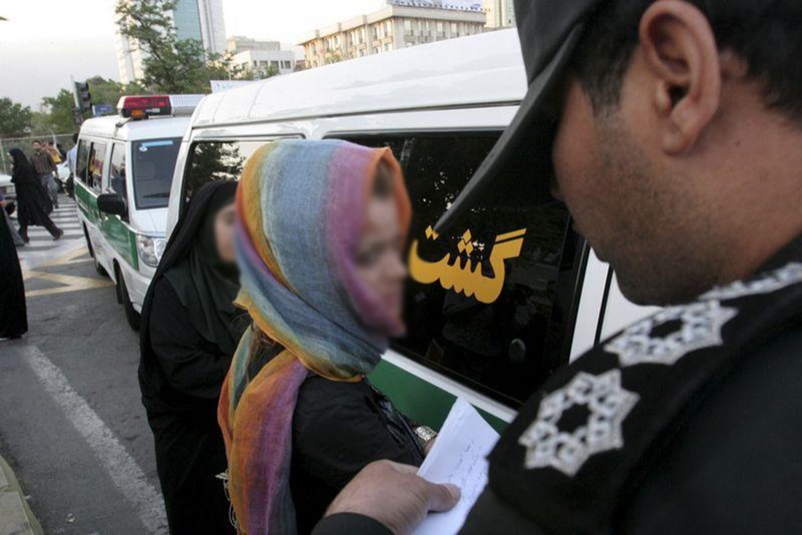 Iran moral police take down the name of a detained woman during a crackdown on "social corruption" in north Tehran in June 18, 2008. - Reuters file photo used for representation.