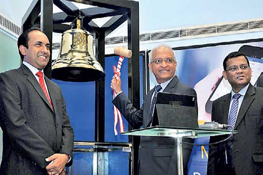 Sri Lanka's LVL Energy Fund CEO Sumitha Arangala declares the opening of day’s trading by ringing the bell at the Colombo Stock Exchange trading floor — a customary thing for a new IPO.
