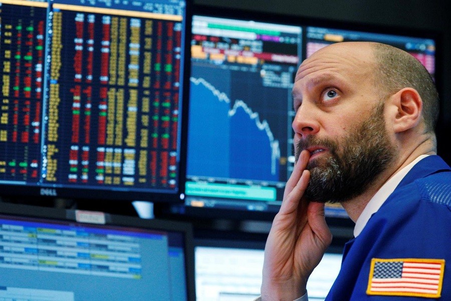 A trader reacts as he watches screens on the floor of the New York Stock Exchange in New York, US, February 5, 2018. Reuters