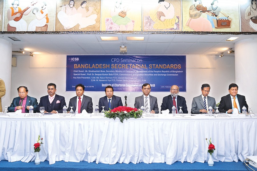 Shubhashish Bose (4th from left), Secretary, Ministry of Commerce addressing the Continuing Professional Development (CPD) seminar on "Bangladesh Secretarial Standards adopted by ICSB", arranged by Institute of Chartered Secretaries of Bangladesh (ICSB) Friday