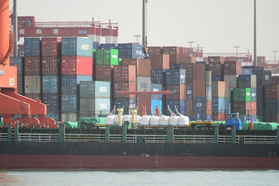 A truck transporting imported raw materials of industrial chemicals is seen at a port in Qingdao, Shandong province, China April 15, 2018. Reuters