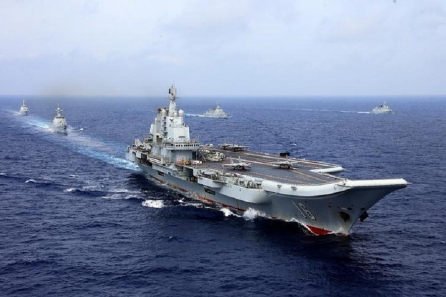China's aircraft carrier Liaoning (C) takes part in a military drill of Chinese People's Liberation Army (PLA) Navy in the western Pacific Ocean, April 18, 2018. Reuters