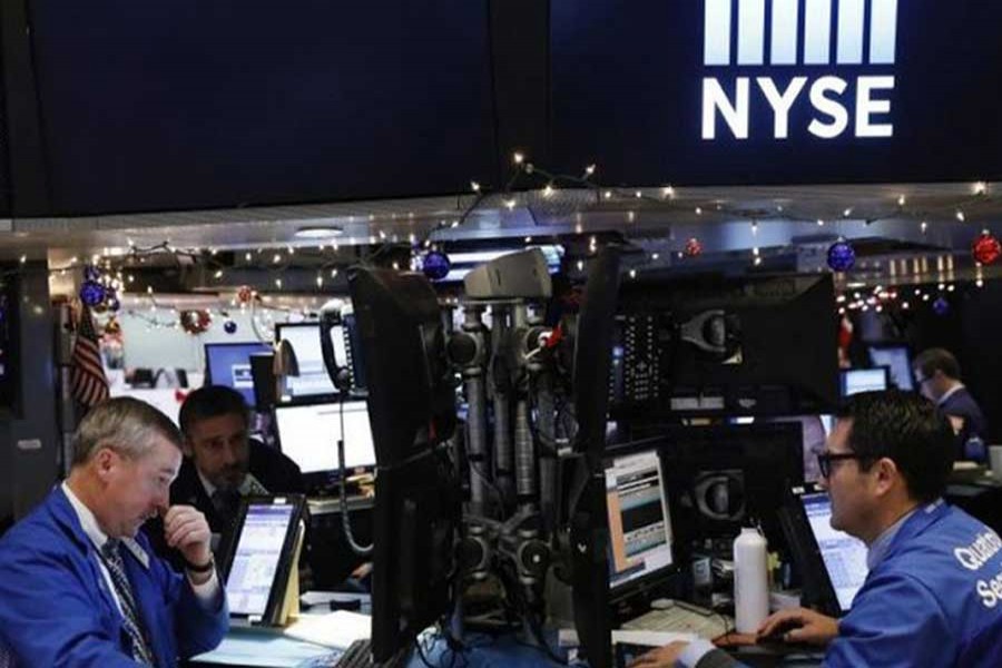 Traders work on floor of the New York Stock Exchange shortly before the close of trading in New York, US, December 13, 2016. Reuters/Files