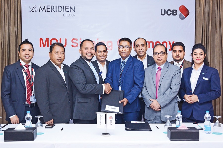 Head of Retail Business of United Commercial Bank Limited Taufiq Hassan and Director of Sales & Marketing of Le Méridien Dhaka Anwar Hossain exchanging documents after signing an MOU on behalf of their respective organisations at the premises of the hotel recently. Under the MOU, UCB Platinum Credit Cardholders will enjoy 'Buy One Get One Free' buffet meal at "Latest Recipe" and "Olea" restaurant of Le Méridien Dhaka.
