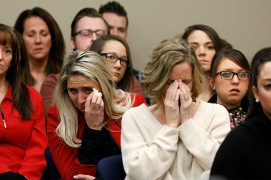 Victims and others look on as Rachael Denhollander speaks at the sentencing hearing for Larry Nassar, a former team USA Gymnastics doctor who pleaded guilty in November 2017 to sexual assault charges, in Lansing, Michigan, US, January 24, 2018. Reuters.