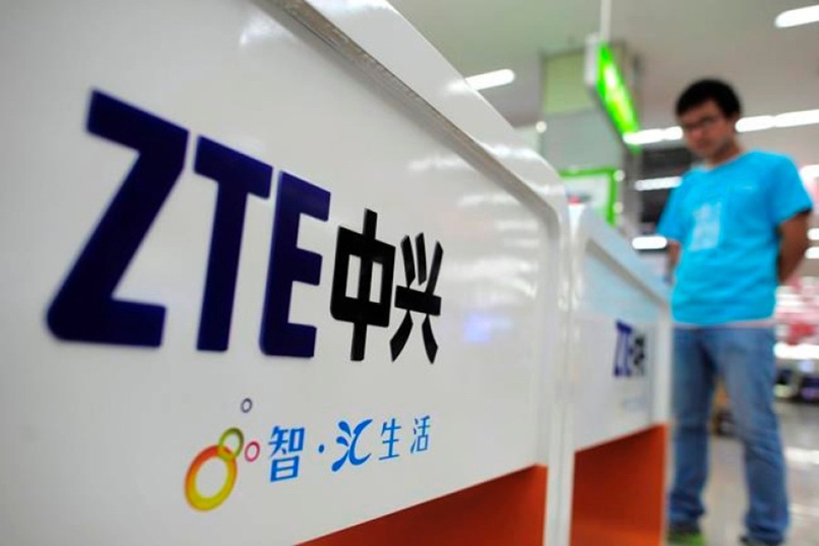 A salesperson stands at counters selling mobile phones produced by ZTE Corp at an appliance store in Wuhan in central China's Hubei province - AP file photo used for representation