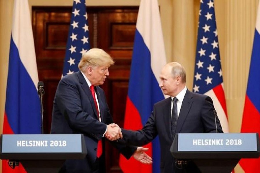 US President Donald Trump and Russian President Vladimir Putin shake hands as they hold a joint news conference after their meeting in Helsinki, Finland July 16, 2018. Reuters