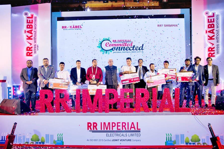 Participants posing with their crests and certificates in presence of Chairman of RR-Imperial Electricals Ltd. Tri Bhuban Prasad Kabra, Director and CEO Mahbub Hossain Mirdha, and other officials at 'The National Partners' Meet 2017-18' of the company in the capital recently