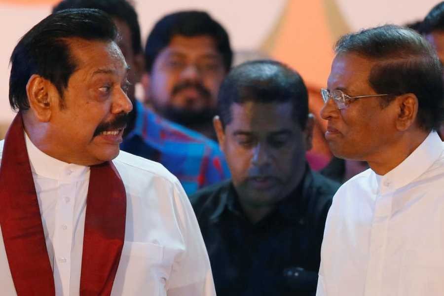 Sri Lanka's newly appointed Prime Minister Mahinda Rajapaksa talks with President Maithripala Sirisena during a rally near the parliament in Colombo, Sri Lanka November 5, 2018 - Reuters/Dinuka Liyanawatte/File Photo