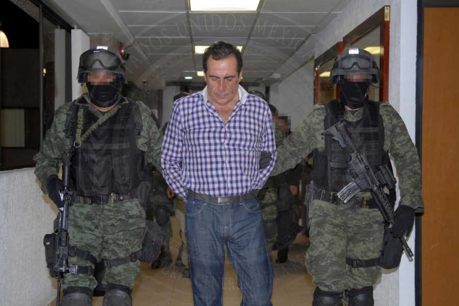 Soldiers escort head of the Beltran Leyva drug cartel Hector Beltran Leyva in Mexico City, in this handout picture taken October 1, 2014 and released to Reuters on October 2, 2014 by the Attorney General's Office - Reuters/Attorney General's Office/Handout