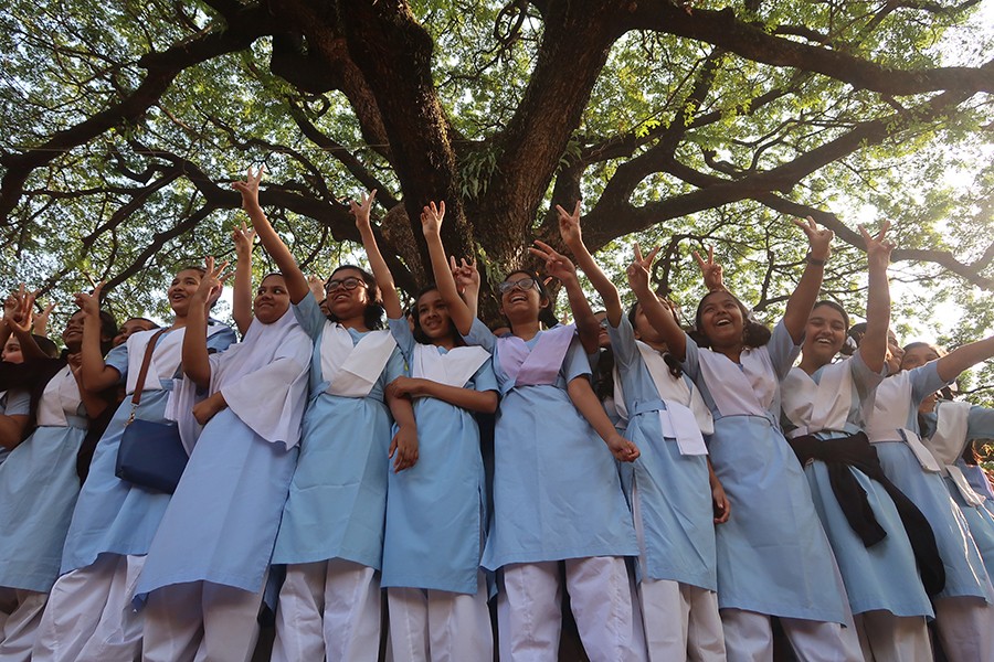 Students at a school in Dhaka cheer after the JSC exam results — FE/File