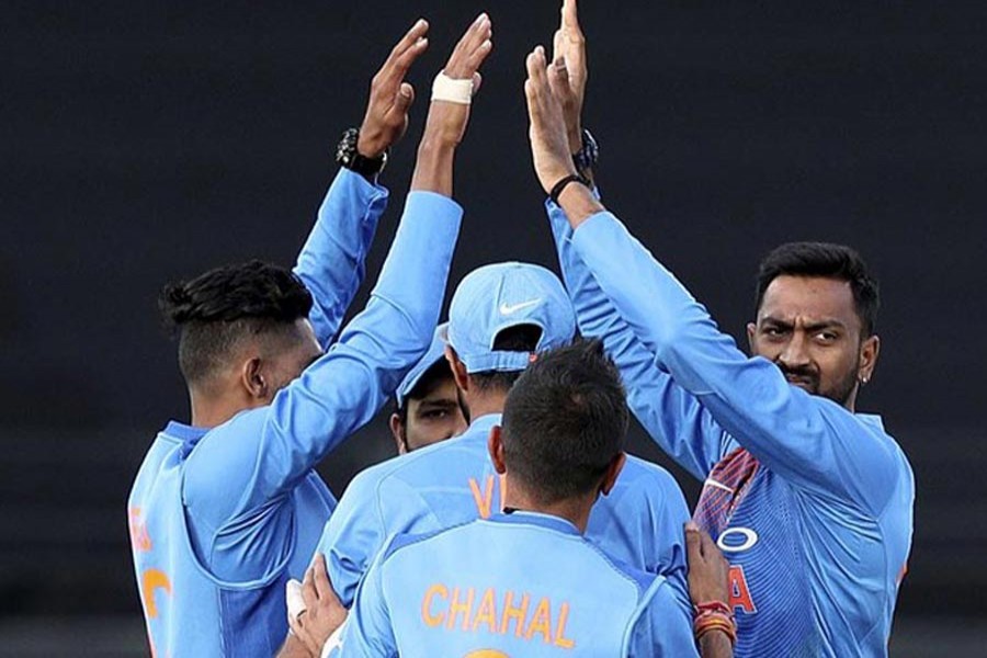 India's Krunal Pandya celebrating with teammates after taking the wicket of New Zealand's Colin Munro during the 2nd T20 international match at Eden Park in Auckland on Friday	— AP