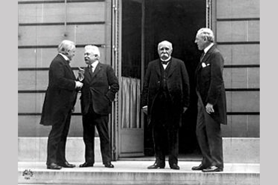 The Council of Four (from left to right) David Lloyd George (UK), Vittorio Emanuele Orlando (Italy), Georges Clemenceau (France) and Woodrow Wilson (USA)  in Versailles in 1919.	– Wikipedia